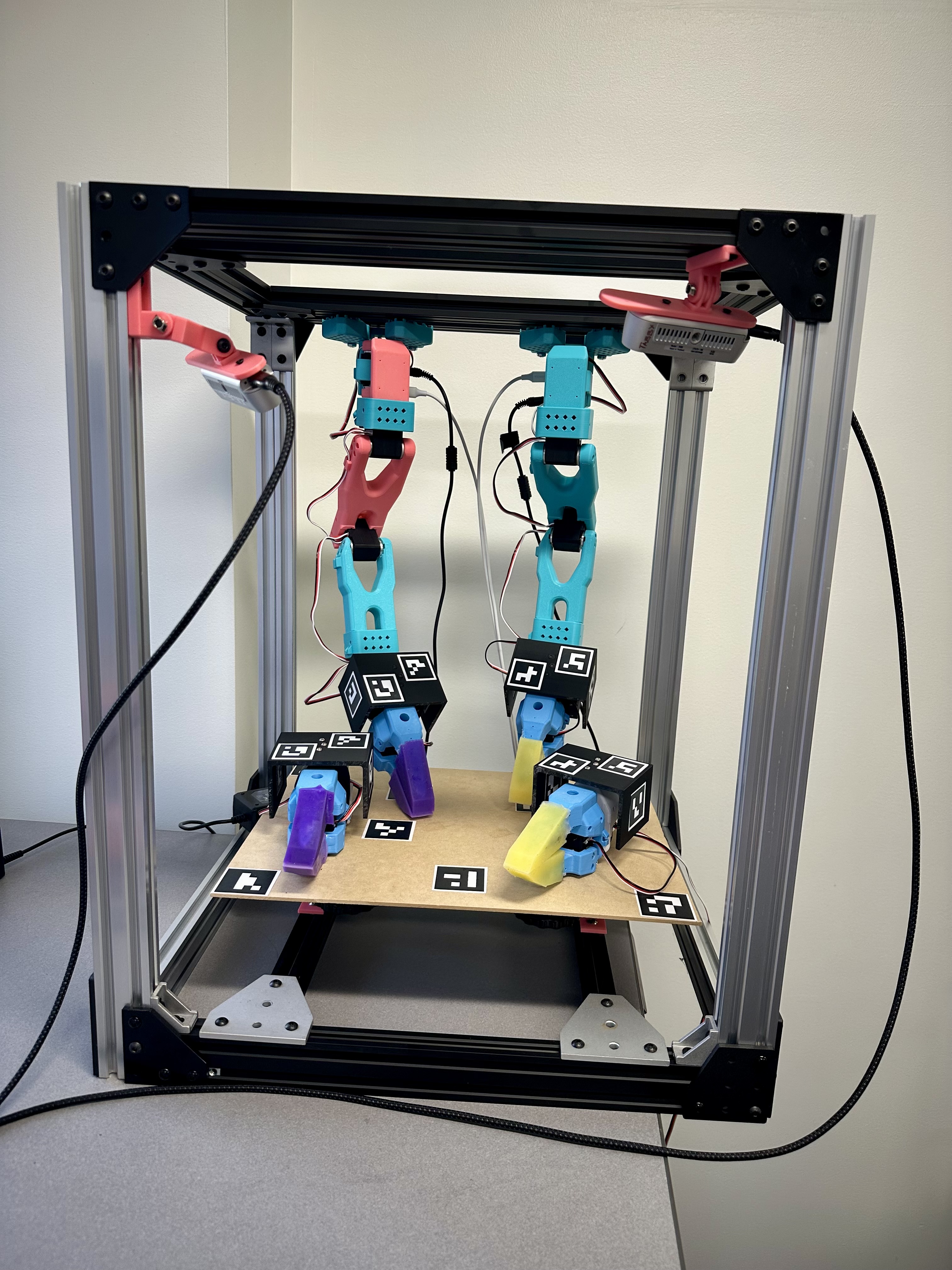 Current Sew Unit physical setup — bimanual SO-101 arms in aluminum frame